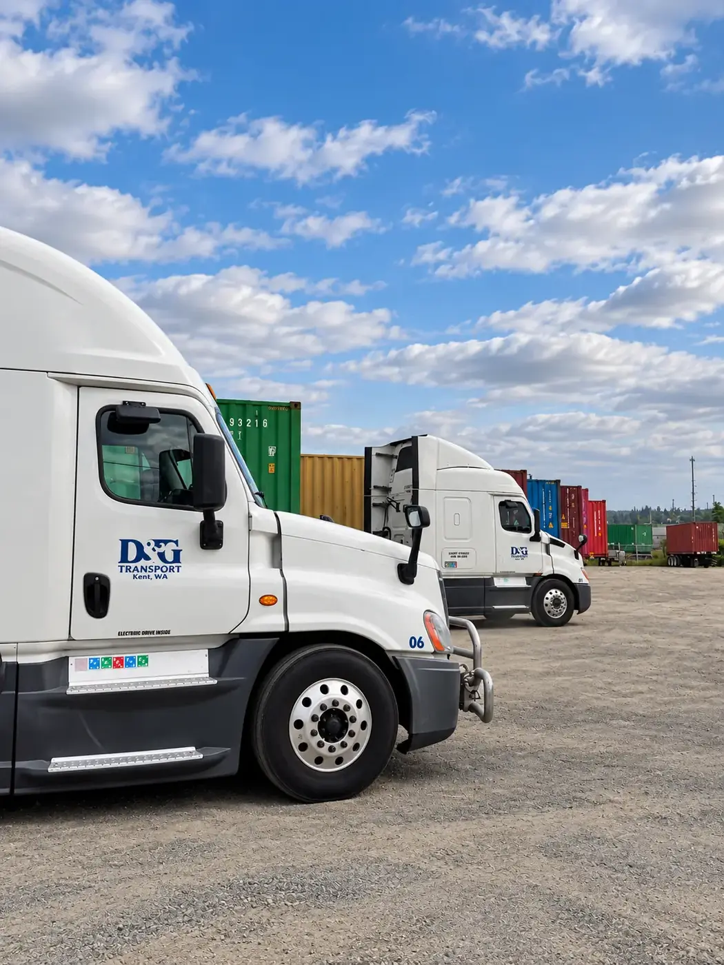 D&G Transport Kent, WA tractors parked in a line beside stacked ocean containers