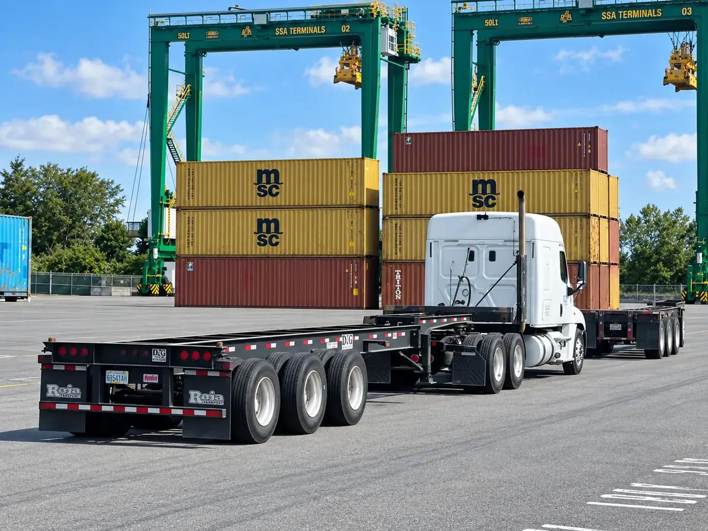 D&G Transport tractor pulling a bare container chassis under terminal gantry cranes