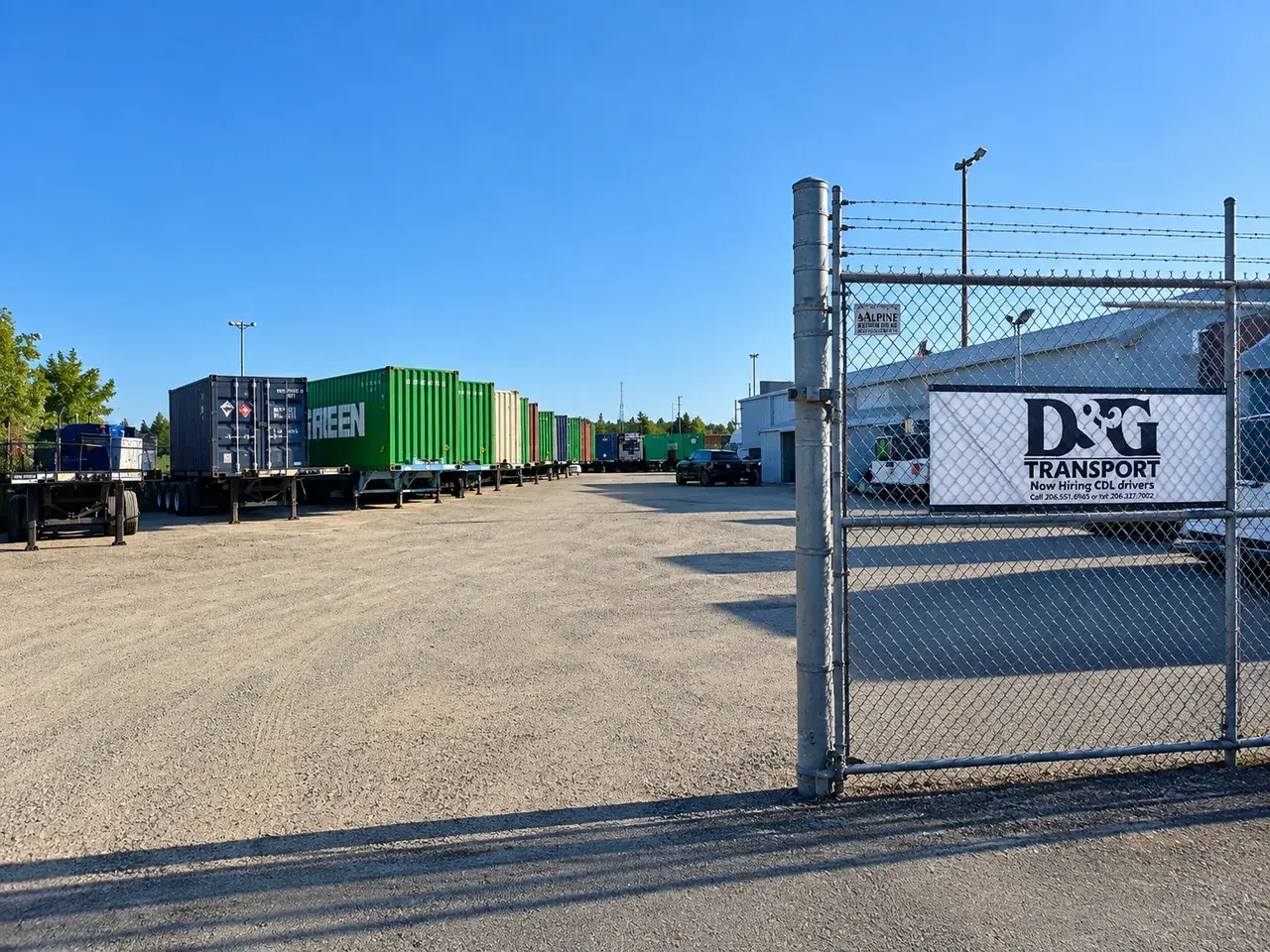 D&G Transport yard gate with containers on chassis lined up along the gravel yard